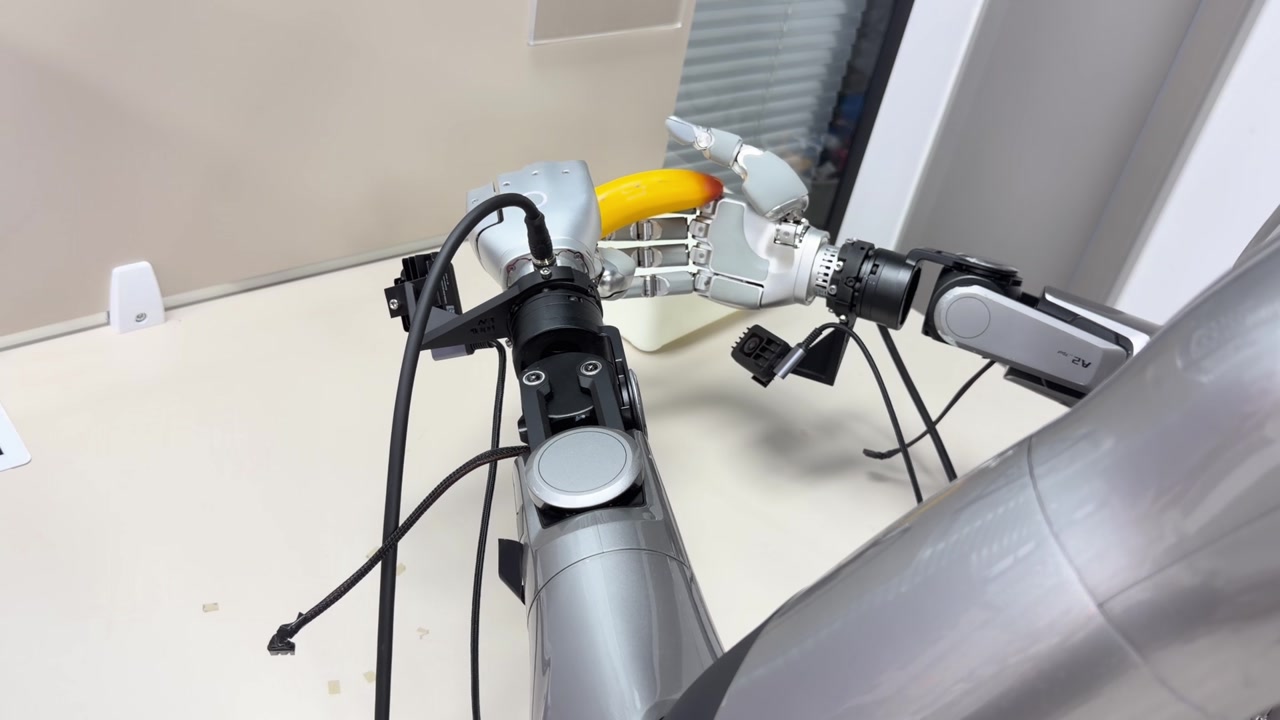 Robot transferring a banana between its hands