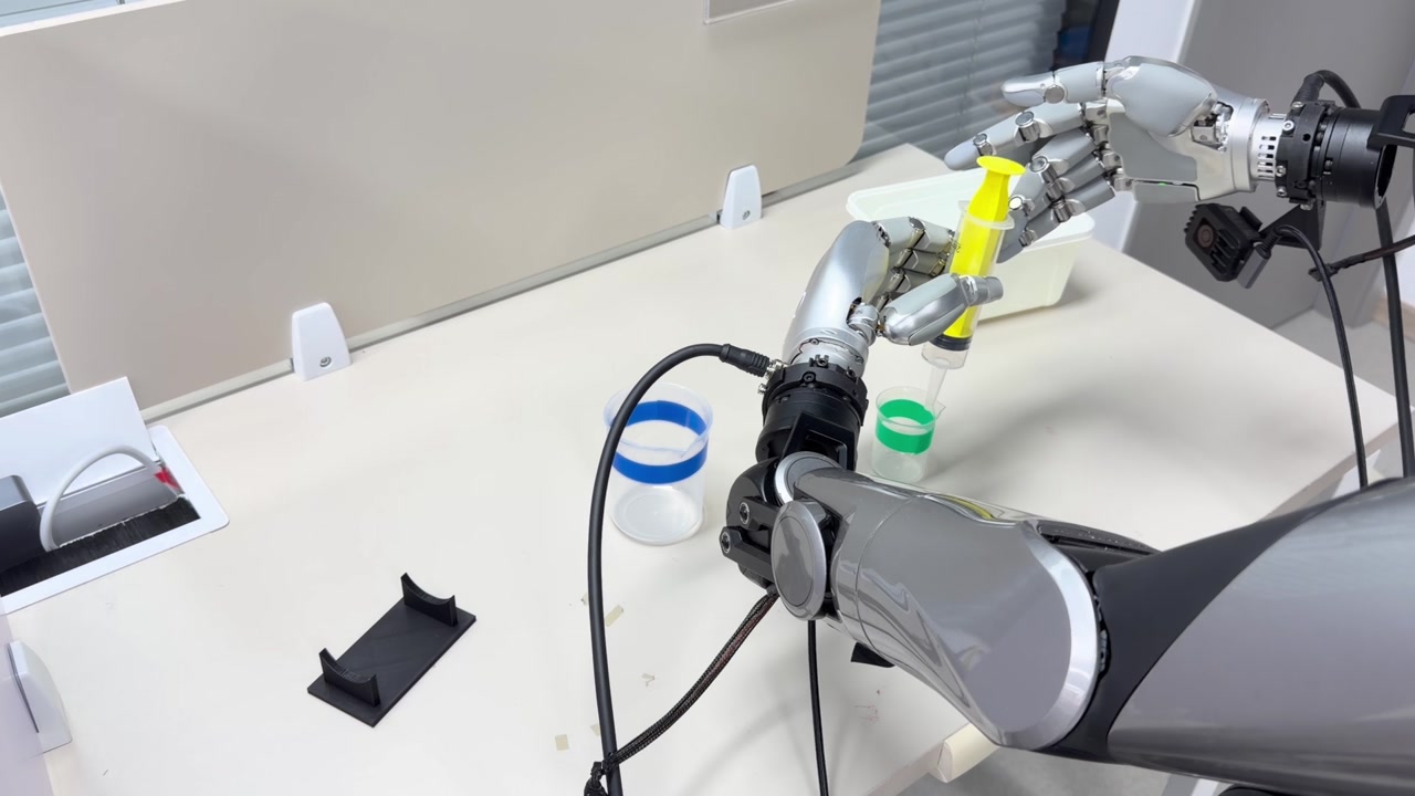 Robot manipulating a syringe between two beakers